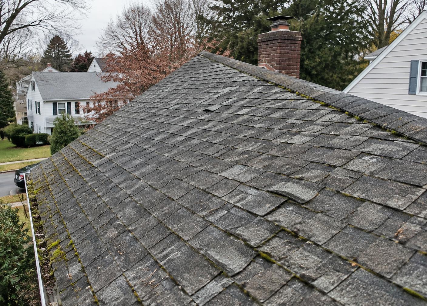 Worn shingles before replacement